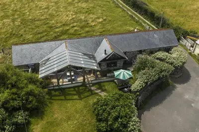 an aerial view of a large house with a porch at Horseshoe Cottage in Newquay