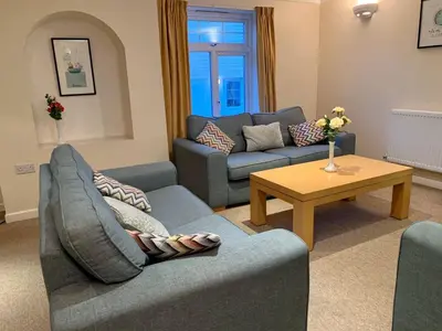 a living room with two couches and a coffee table at 79 Atlantic Reach in Newquay