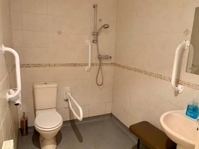 a bathroom with a shower and a toilet and a sink at 79 Atlantic Reach in Newquay