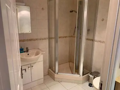 a bathroom with a shower and a sink at 79 Atlantic Reach in Newquay