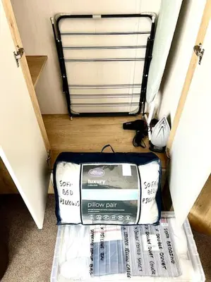 a suitcase sitting on the floor in a room at The Driftwood Den in Tywardreath