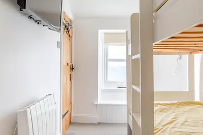 a bedroom with a bunk bed and a window at 2 Bed in Porthleven oc-m28188 in Porthleven