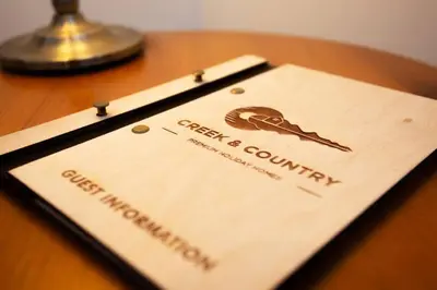 a card on top of a wooden table at Tredreath, Manor Cottages in Falmouth