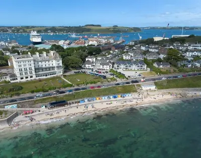 an aerial view of a beach with a group of people at Tredreath, Manor Cottages in Falmouth