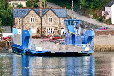 a blue boat is docked in the water at 2 Bed in Ruan High Lanes oc-r29865 in Ruan Lanihorne