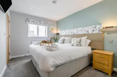 a bedroom with a large white bed and a window at 6 Bed in Winnards Perch oc-t29966 in Saint Columb Major