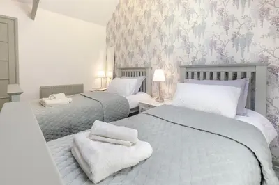 a bedroom with two beds with towels on them at 2 Bed in Trewoon oc-t29504 in St Austell