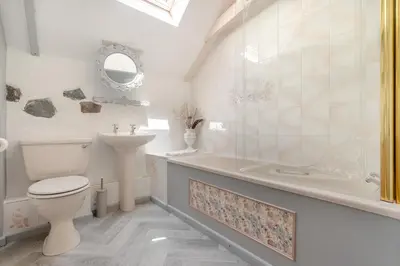 a bathroom with a toilet and a tub and a sink at 2 Bed in Trewoon oc-t29504 in St Austell