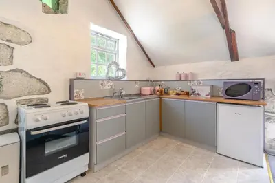 a kitchen with a stove and a sink at 2 Bed in Trewoon oc-t29504 in St Austell