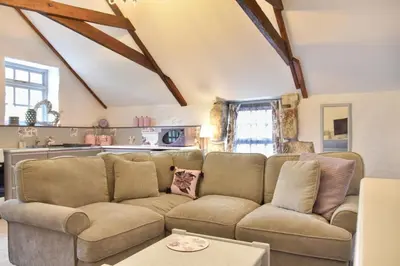 a living room with a couch and a table at 2 Bed in Trewoon oc-t29504 in St Austell