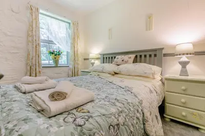 a bedroom with a bed with towels on it at 2 Bed in Trewoon oc-t29503 in St Austell