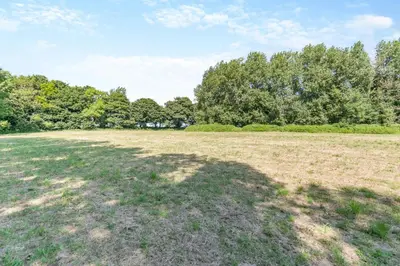 an empty field with trees in the background at 2 Bed in Trewoon oc-t29503 in St Austell