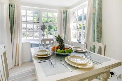 a dining room table with a bowl of fruit on it at 2 Bed in Trewoon oc-t29503 in St Austell