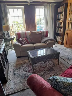 a living room with a couch and a coffee table at Puddle Duck Peeps Out Chalet in Saint Martin