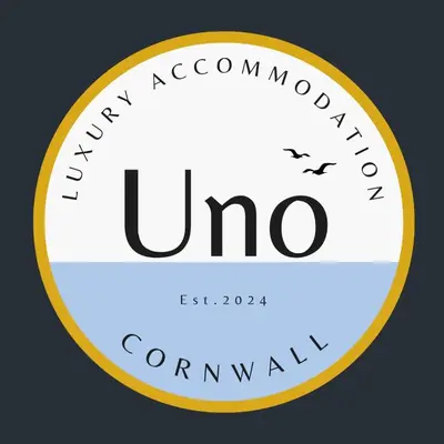 a yellow and white circle with the words uno at Uno Carbis Bay - Boutique Luxury Accommodation in Carbis Bay