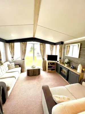 a large living room with couches and a tv at The Lobster Pot in Tywardreath