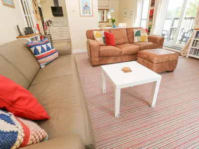 a living room with a couch and a coffee table at 5 Tregenna Court in Falmouth