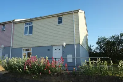 a house with flowers in front of it at Eventide in Newquay