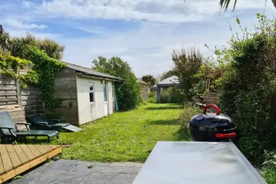 a backyard with a pot sitting on a table at The Light House in Gwithian