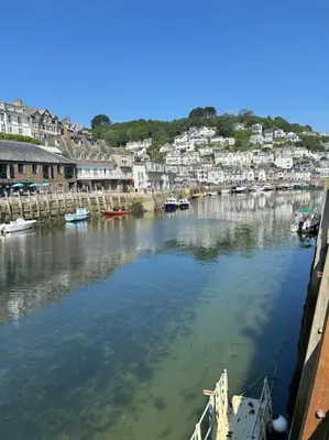 a view of a river with boats in a harbor at Chy Pyscador in Looe