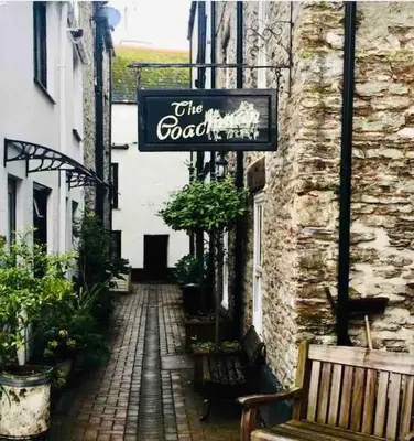 a sign on the side of a building at Chy Pyscador in Looe
