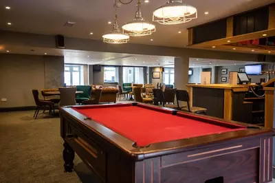 a pool table in a room with a bar at Pool - Fireplace - 2Br Lodge - PetsOK - Parking in Newquay