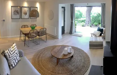 a living room with a couch and a table at Stunning getaway in Wadebridge, Cornwall in Wadebridge