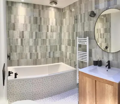 a bathroom with a tub and a sink and a mirror at Stunning getaway in Wadebridge, Cornwall in Wadebridge