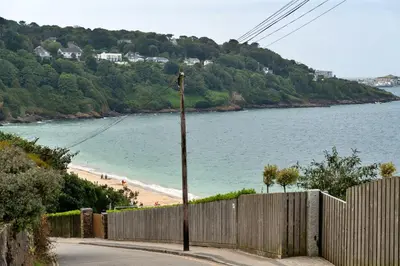 a wooden fence next to a beach with a fence gmaxwell gmaxwell gmaxwell at Finest Retreats - Blue Horizon in St Ives