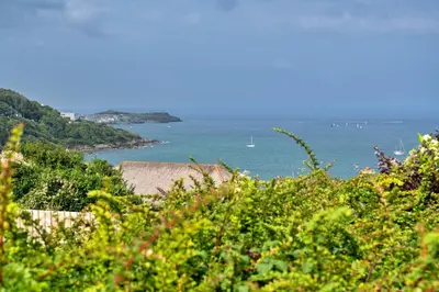 a view of the ocean from a hill at Finest Retreats - Blue Horizon in St Ives