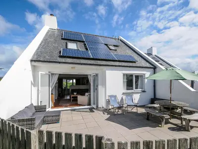 a house with solar panels on the roof at Bryher in Wadebridge