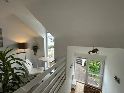 a staircase in a house with a window at Newly renovated beach house on the coast in Saint Columb Minor