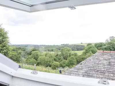 a view from the window of a house with a roof at Skiber Coombe in Callington