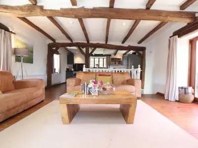 a living room with a couch and a coffee table at Skiber Coombe in Callington