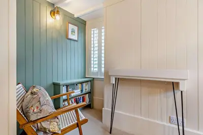 a room with a book shelf and a table at 2 Bed in St. Columb oc-h29936 in Saint Columb Major