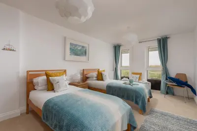 a bedroom with two beds and a window at Host & Stay - Sunset in Newquay