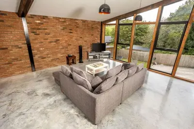 a living room with a couch and a tv at Great Cornish Coastal Retreat in Par