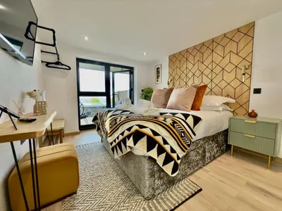 a bedroom with a bed with a zebra blanket at Bayvista in St Ives