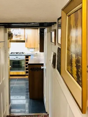 a kitchen with a sink and a counter in a room at Seaway Beach House Looe Beach in Looe
