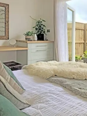 a bedroom with a bed with a blanket on the floor at The Cuckoo's Nest - A Romantic & Peaceful Hideaway in Kenwyn