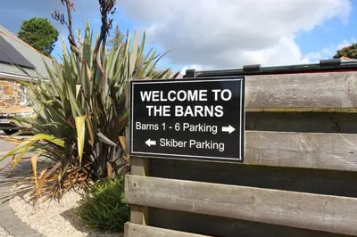 a sign that says welcome to the barnsams parking at The BarnsPigallie in Redruth