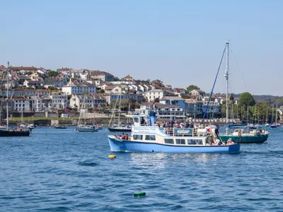 a group of people on a boat in the water at Chy Lowena in Falmouth