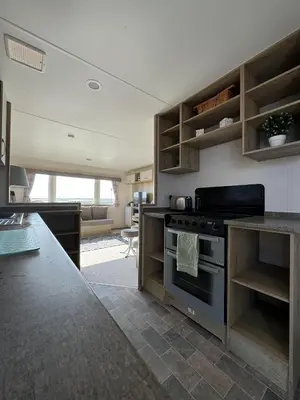 a kitchen with a stove and a counter top at Perranporth Coastal Retreat- Sleeps8 in Perranporth