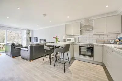 a kitchen with a table and a couch at 118 Sandyfeet Retreat in Saint Martin