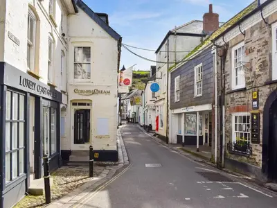 an empty street in an old town with buildings at Harbour Reach in Mevagissey