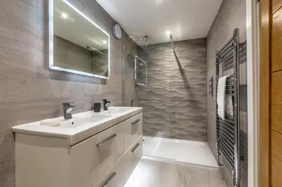 a white bathroom with a sink and a shower at 4 Bed in Carbis Bay oc-m30075 in Carbis Bay