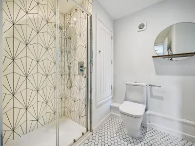 a bathroom with a shower and a toilet at Fairwinds in Portreath