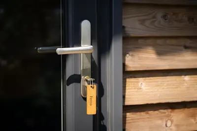 a metal door with a tag on it at Grassington Farm by Wigwam Holidays in Helston