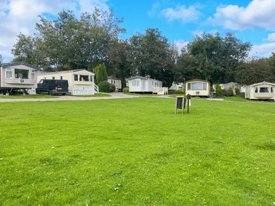 a yard with a group of mobile homes at Sandy Toes in Newquay