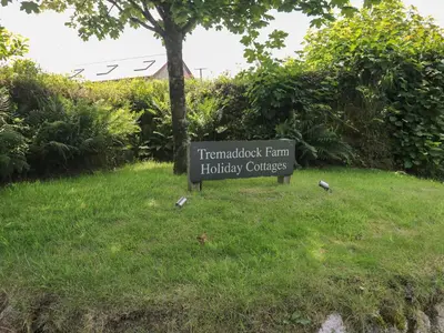 a sign for the thermetologist farm holiday courses at The Stables in Liskeard